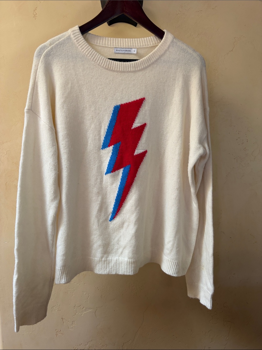 Sz L South Parade Ivory Sweater with Red & Blue Lightning Bolt